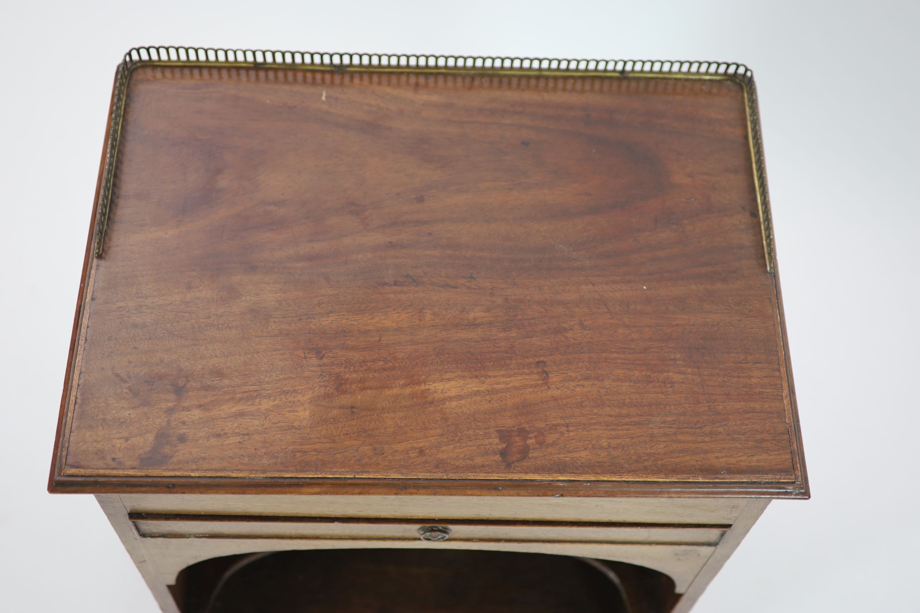 Royal furniture. A William IV mahogany bedside cupboard combined writing chest, H 77cm. W 58cm. D 42cm.